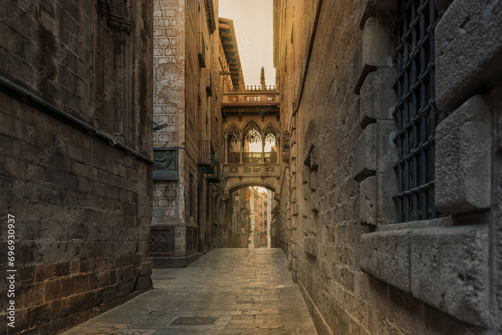 View of bridge between buildings in Barri Gotic quarter of Barcelona, Spain.