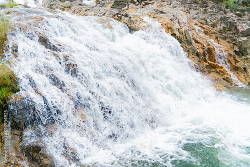 A waterfall in a nature park. Cloudy weather. Yang Bay Ecopark in Vietnam near Nha Trang.