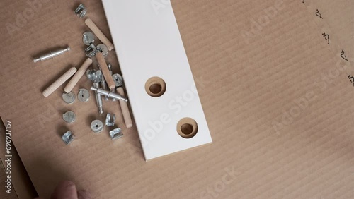 new Cardboard box of IKEA home furniture set. furniture assembler starting to assemble the interior furniture, open