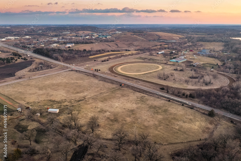 Dirt Horse Racing Track And Surrounding Landscape at Sunset