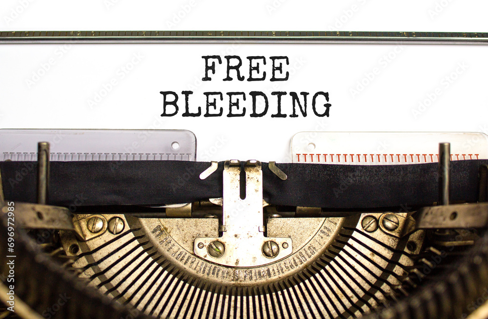Free bleeding symbol. Concept words Free bleeding typed on beautiful old retro typewriter. Beautiful white paper background. Gen Z, motivational, freedom free bleeding concept. Copy space.