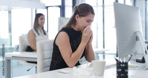 Woman, sick and blowing nose in office, computer and virus for infection, sinus and cold symptoms. Sneeze, colleague and allergy in workplace, hayfever and healthcare for disease or spread germs photo