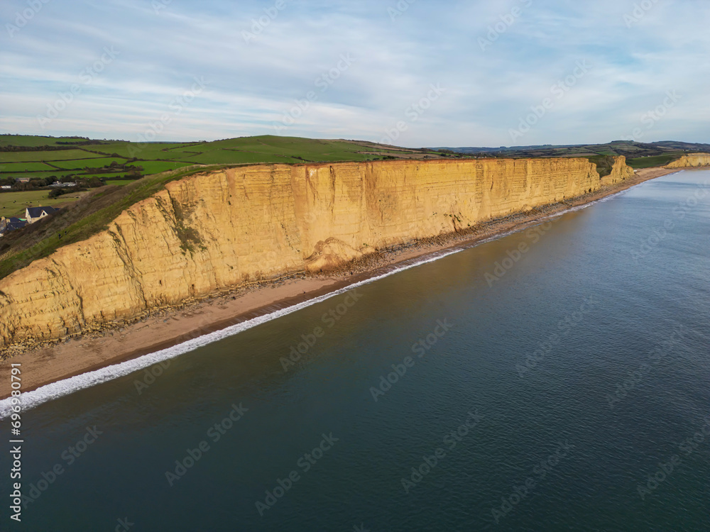 The towering cliffs at West Bay on the Jurassic Coast of Dorset England UK