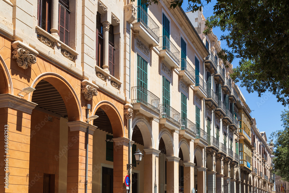 Facades with balconies of historic residential buildings in the center of Palma de Mallorca.