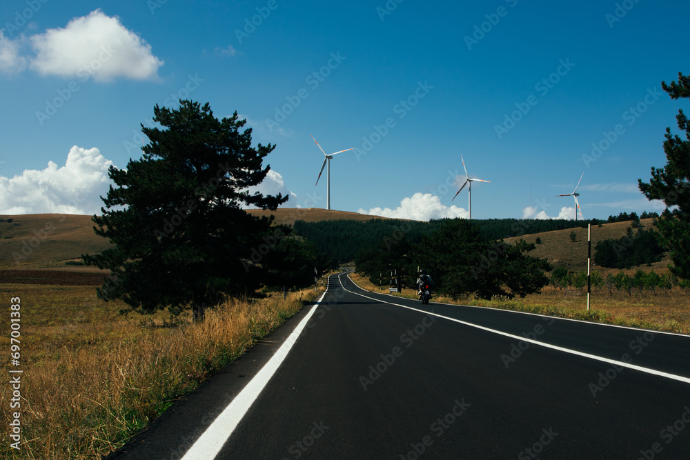 Wind farm in the Italian mountains. The green economy and technology are the only solution to protect the planet from climate change global warming with a green natural industry