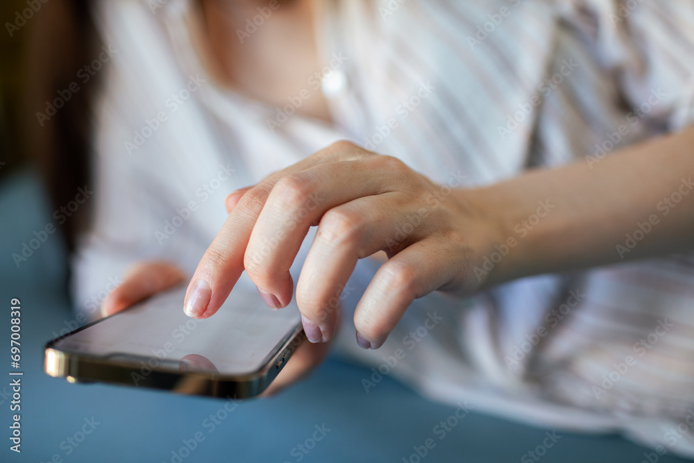 Young woman using a smartphone in bed Young woman using a smartphone in bed
