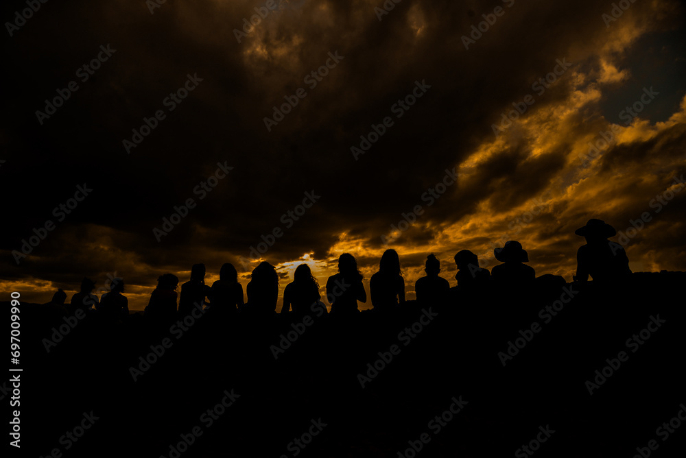 crowd at sunset, silhouette of a persons, silhouettes of people in the sunset, peoples at sunset, silhouette of people, group of people at sunset, group of people