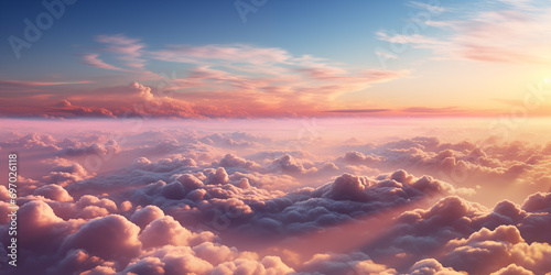 Beautiful aerial view above clouds at sunset. Flying above clouds with sunlight. photo