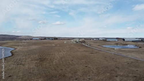 Drone flight over the Big Rock glacial erratic near Okotoks, Alberta, Canada photo