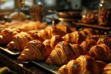 Golden Symphony of Morning Bliss: A Baker Unveils a Tray Overflowing with Fragrant Croissants, Each Gilded Layer Promising a Day of Warmth and Culinary Delight.
