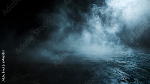 Empty dark background with smoke or fog on the floor.