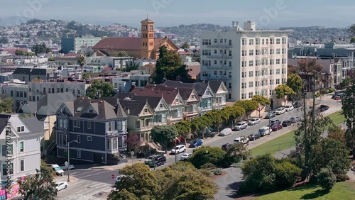 Painted Ladies Victorian houses in Alamo Square. San Francisco, California cityscape at Alamo Square. It is the row of Victorian houses at Steiner. photo