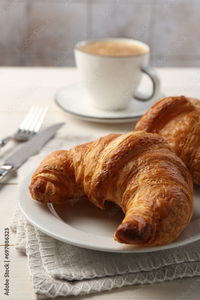 Delicious fresh croissants served on table, closeup Delicious fresh croissants served on table, closeup