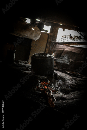 pan on wood stove,mud house kitchen, mud house interior, mud house, social inequality, misery, poverty, Brazil, calamity