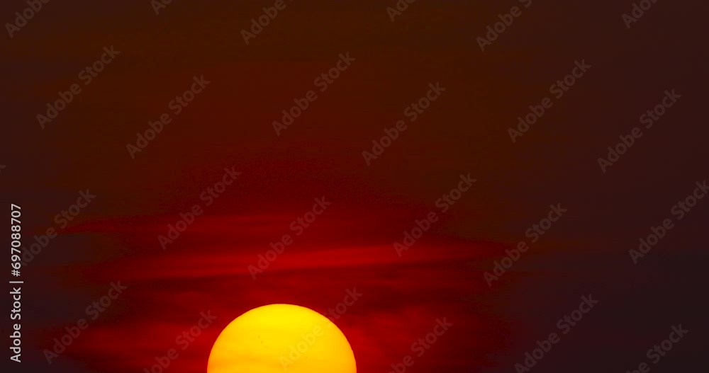 Big Sunrise Timelapse video Close-up the sun in red cloud sky over horizontal.ProRes422