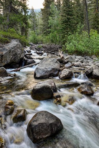 The Stillwater River rushes over rocks at the Woodbine Campground in the Custer Gallatin National Forest, Montana, USA photo