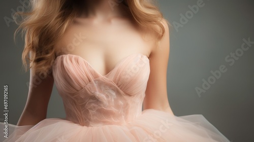 Closeup of a highwaisted Peach Fuzz with a sweetheart neckline and a flattering flared silhouette, reminiscent of 1950s style. photo