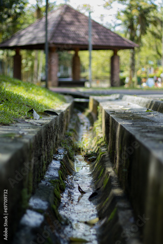 Stream with a hut in the background