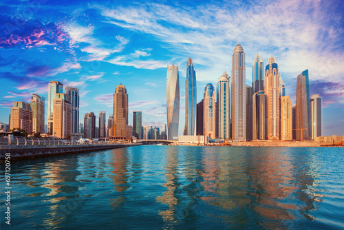 Dubai - The skyline of Downtown. Dubai city - amazing city center skyline and famous Jumeirah beach at sunset, United Arab Emirates 