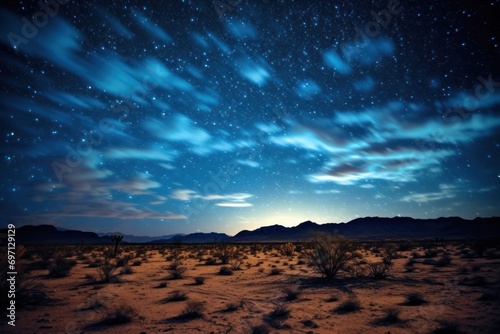 Starry night sky over a peaceful desert landscape.