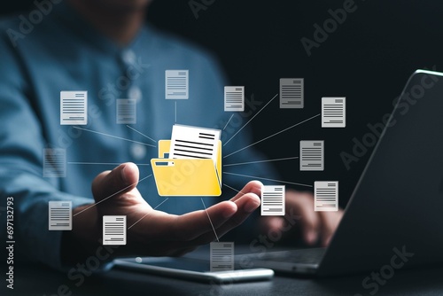 Document management system (DMS) technology, Businessman using laptop with database folder online to store files document data digital. file storage process with security.