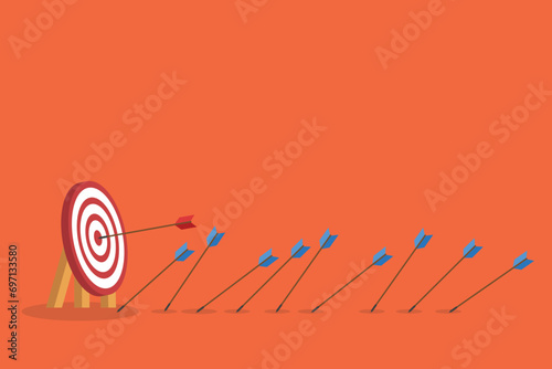 Business challenge failure and success concept. Blue arrows missed hitting target and only red one hits the center.