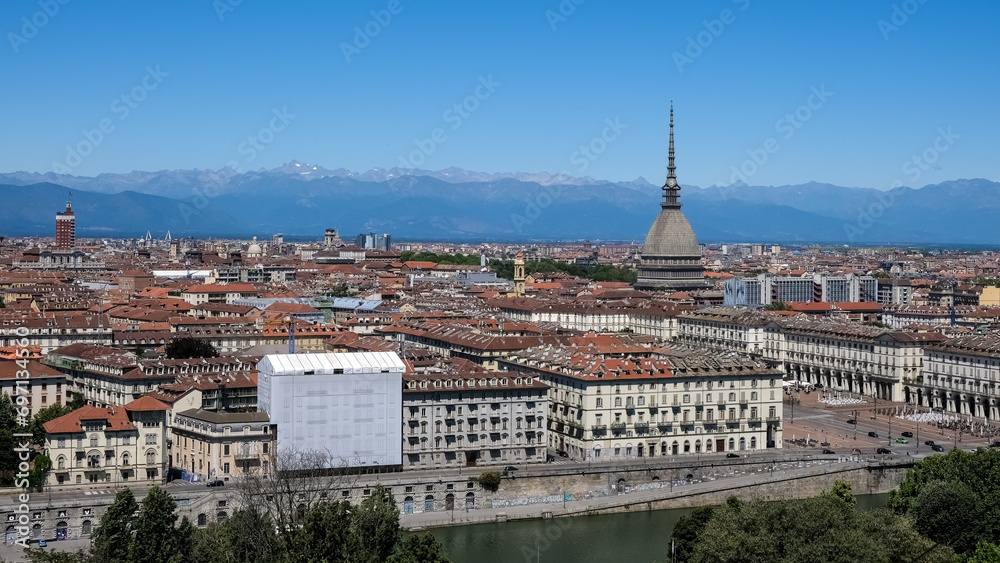 Cityscape of Turin, Italy, featuring the iconic Mole Antonelliana building that stands out among the city's skyline.