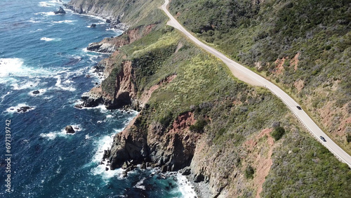 Drone aerial photo of the California coastline with cliffs and rocky beach side coastline on PCH 1