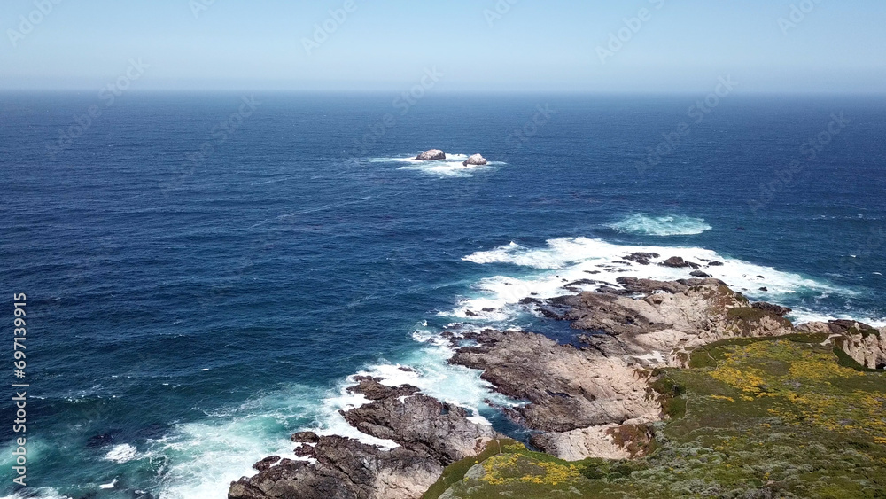 Drone aerial photo of the California coastline with cliffs and rocky beach side coastline Drone aerial photo of the California coastline with cliffs and rocky beach side coastline
