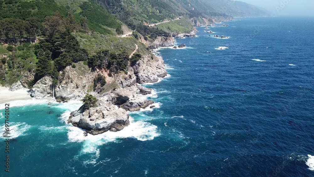 Drone aerial photo of the California coastline with cliffs and rocky beach side coastline