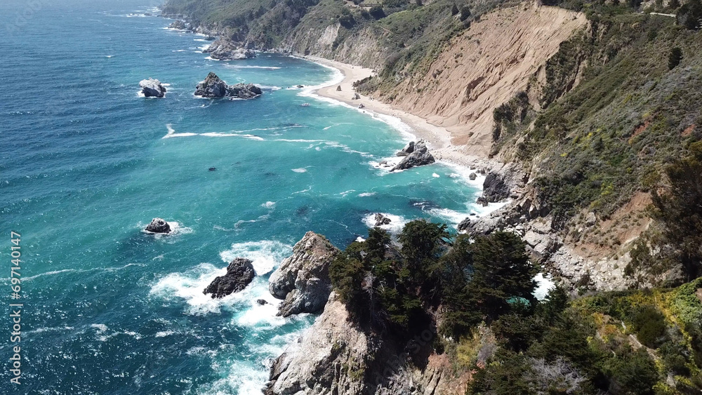 Drone aerial photo of the California coastline with cliffs and rocky beach side coastline