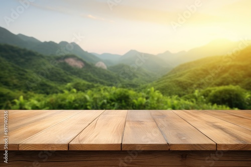 Table background of free space for your decoration and blurred landscape of mountains.