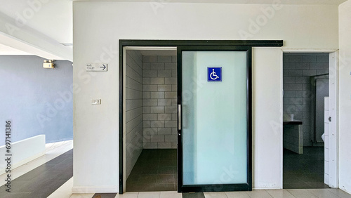 Toilet entrance sign for the disabled, Toilet for the elderly. Toilet aluminum alloy Sliding Glass Doors. Symbol showing toilet for elderly and disabled in the public.