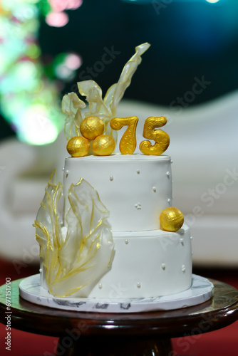 Birthday cake number 75. white cake. Close-up view
