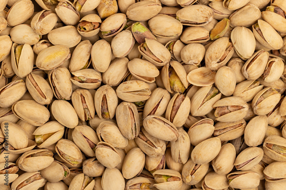 Top view of pistachios layered as a background Top view of pistachios layered as a background