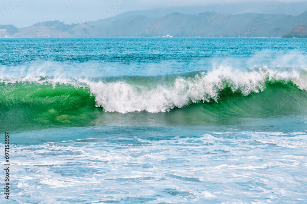Wave splashing close-up. Crystal clear sea water, in the ocean in San Francisco Bay, blue water, pastel colors. Wave splashing close-up. Crystal clear sea water, in the ocean in San Francisco Bay, blue water, pastel colors.