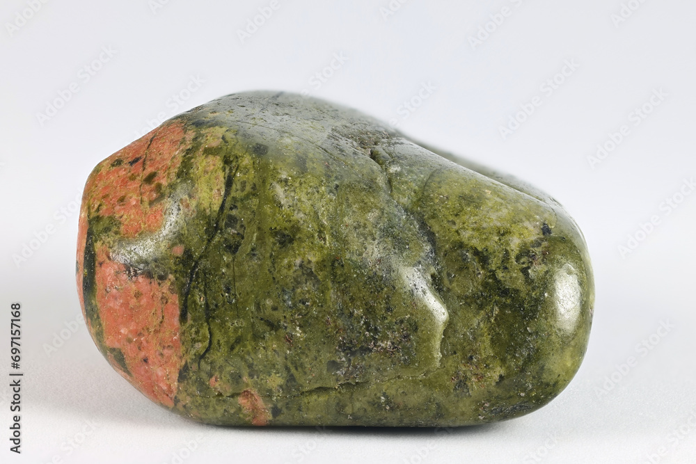 Unakite is an metamorphic rock that is altered granite composed of pink orthoclase feldspar, green epidote, and generally colorless quartz. Unakite is an metamorphic rock that is altered granite composed of pink orthoclase feldspar, green epidote, and generally colorless quartz.