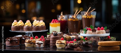 Dessert selection at the restaurant event: candy bar, cakes, pastries, muffins, sugar treats.