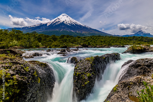 Petrohué Waterfalls with snow-capped Osorno Volcano seen in the background, Vicente Pérez Rosales National Park, Lake District, Chile photo
