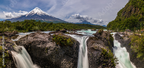 Petrohué Waterfalls with snow-capped Osorno Volcano seen in the background, Vicente Pérez Rosales National Park, Lake District, Chile photo