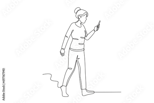 A woman playing social media while walking. Mobile phone addiction one-line drawing