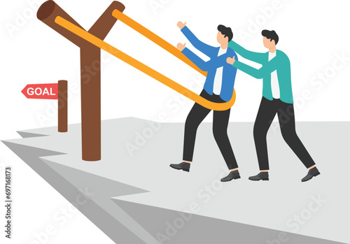 Businessmen on dangerous cliff putting themselves on gigantic Y-shaped slingshot catapult, aiming for business goal.

