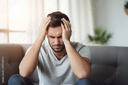 man suffering from depression sitting