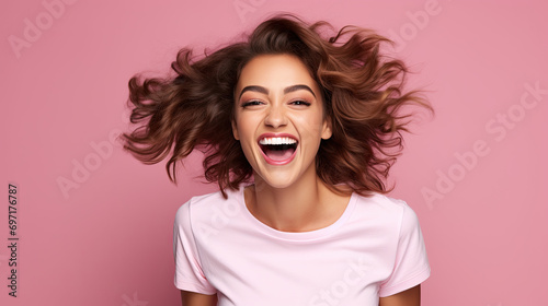 Happy wonderful young woman with long hair, excited funny woman. Isolated on pink background