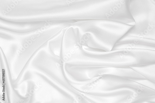 Smooth elegant white silk or satin luxury cloth texture can use as wedding background. Luxurious background design. photo