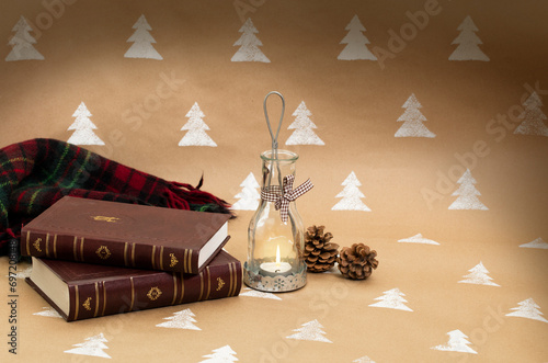 Christmas composition – candleholder, books and blanket. photo