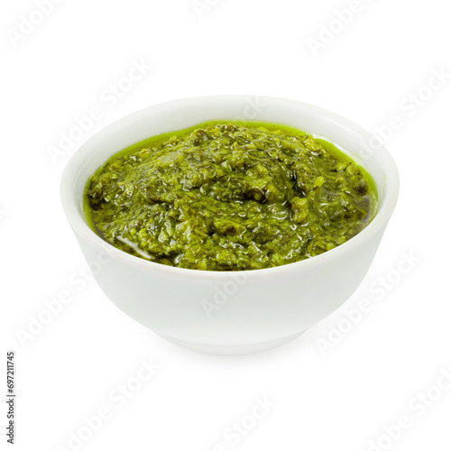 Pesto sauce, on a wooden board, on a white background