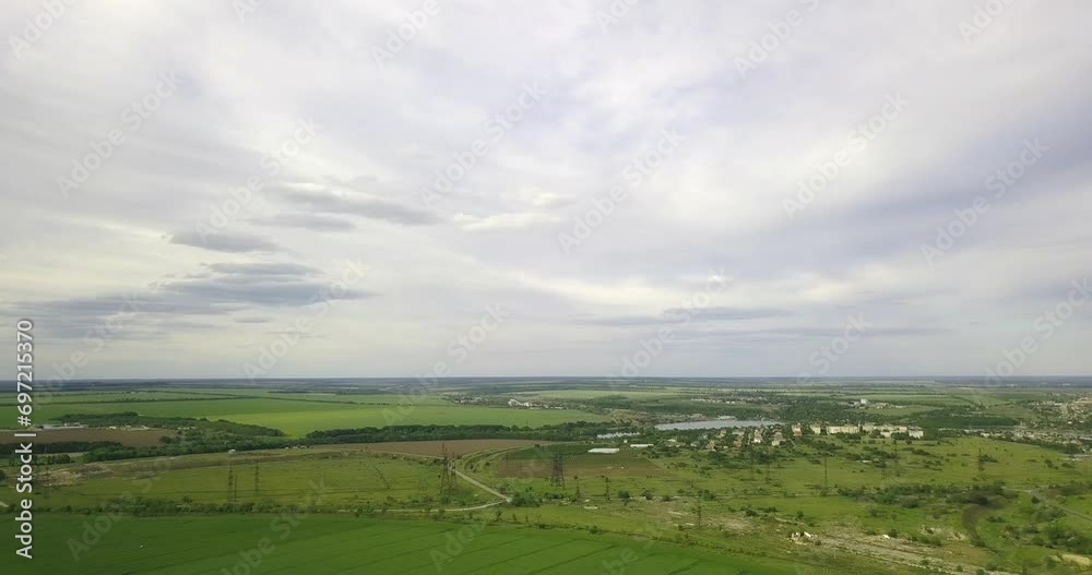 High flight out of town over fields and beautiful clouds, drone High flight out of town over fields and beautiful clouds, drone