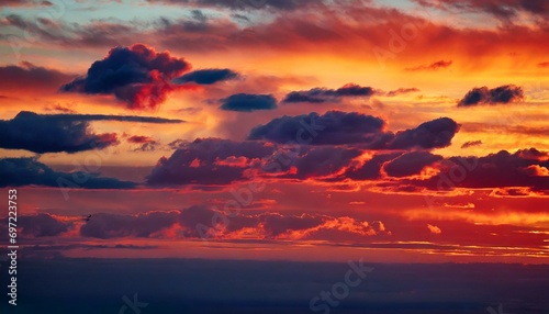 dark red clouds on evening sunset with lights romantic sky