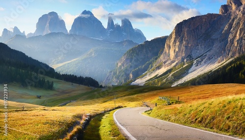 empty country road on venegia valley high altitude dolomite valley natural park with jagged peaks rolling meadows pastures and streams stunning morning scene of italian countryside